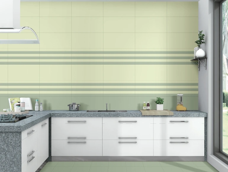 Vibrant L shape kitchen design with grey countertops, a green striped backsplash, and a large window.